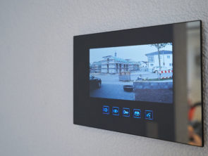 Intercom with video image mounted on the wall in the house.