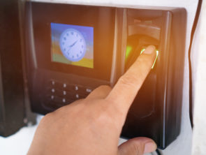 Fingerprint or Thumbprint scanner scan to record at working time in modern office. Easily deposited on suitable surfaces.